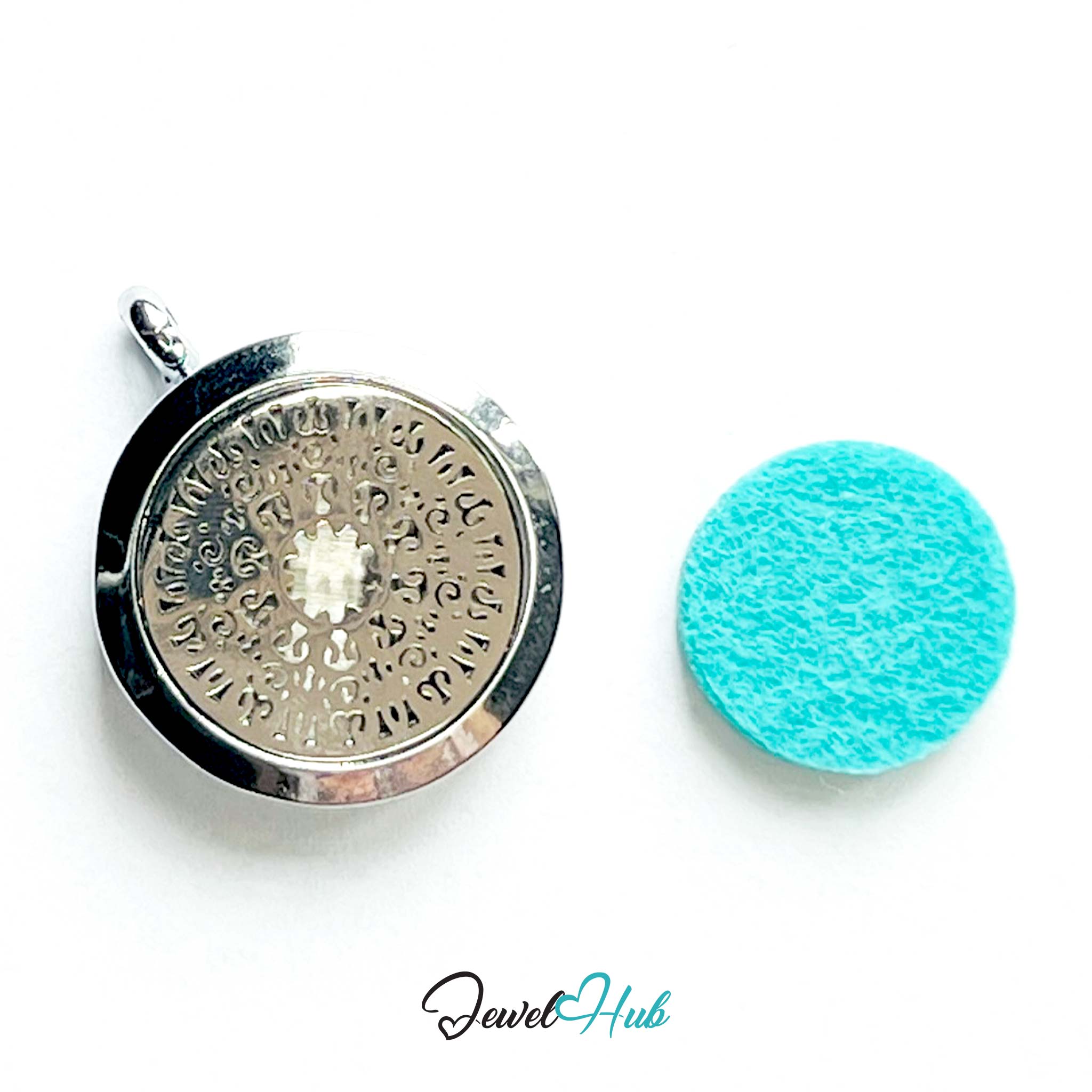 Silver pendant with engraved design and turquoise cleaning cloth on a white background, branded 'Jewel Hub'.