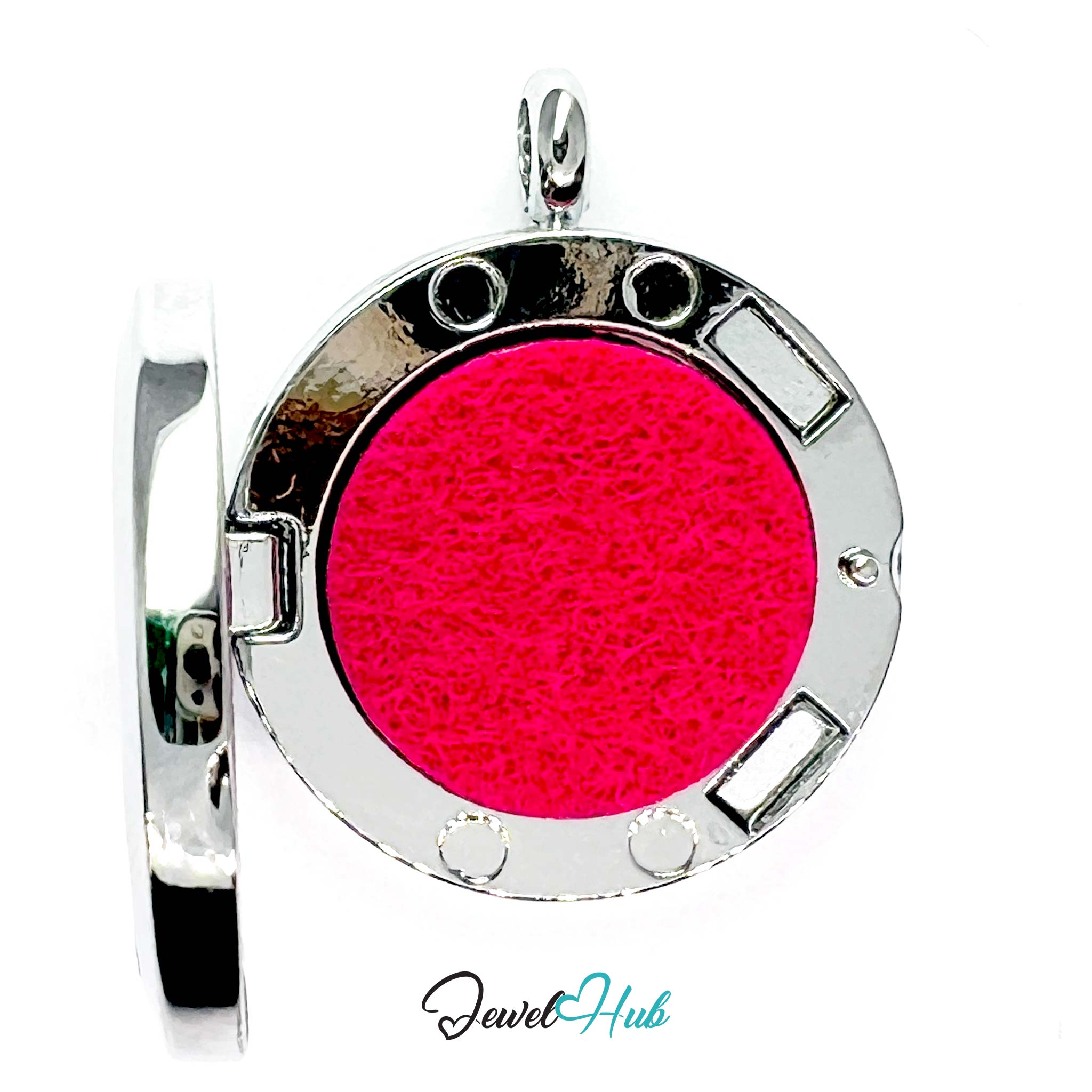 Round pendant with pink center and silver frame on a white background