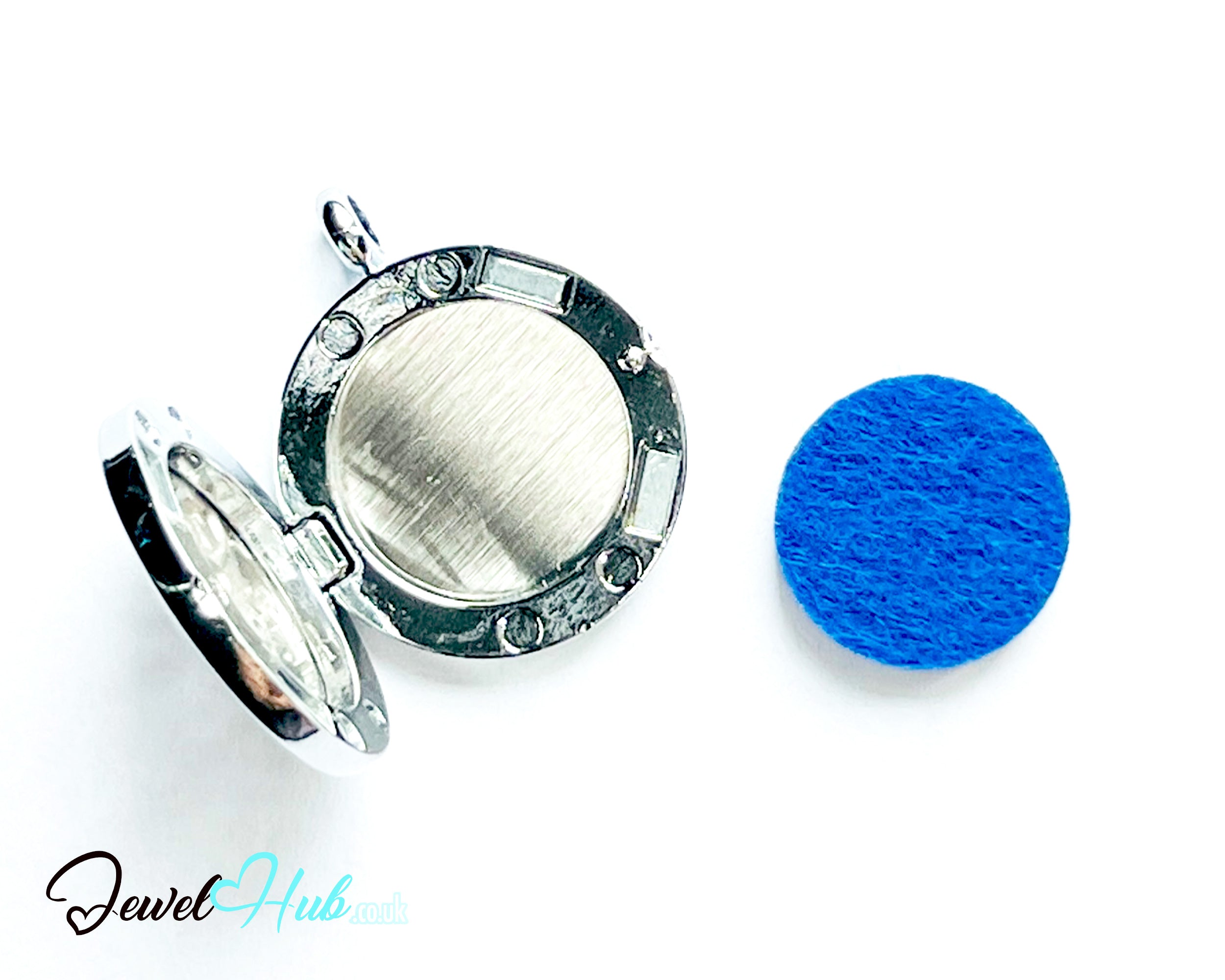 Silver locket with a blue round object on a white background, branded 'Jewel Hub'.