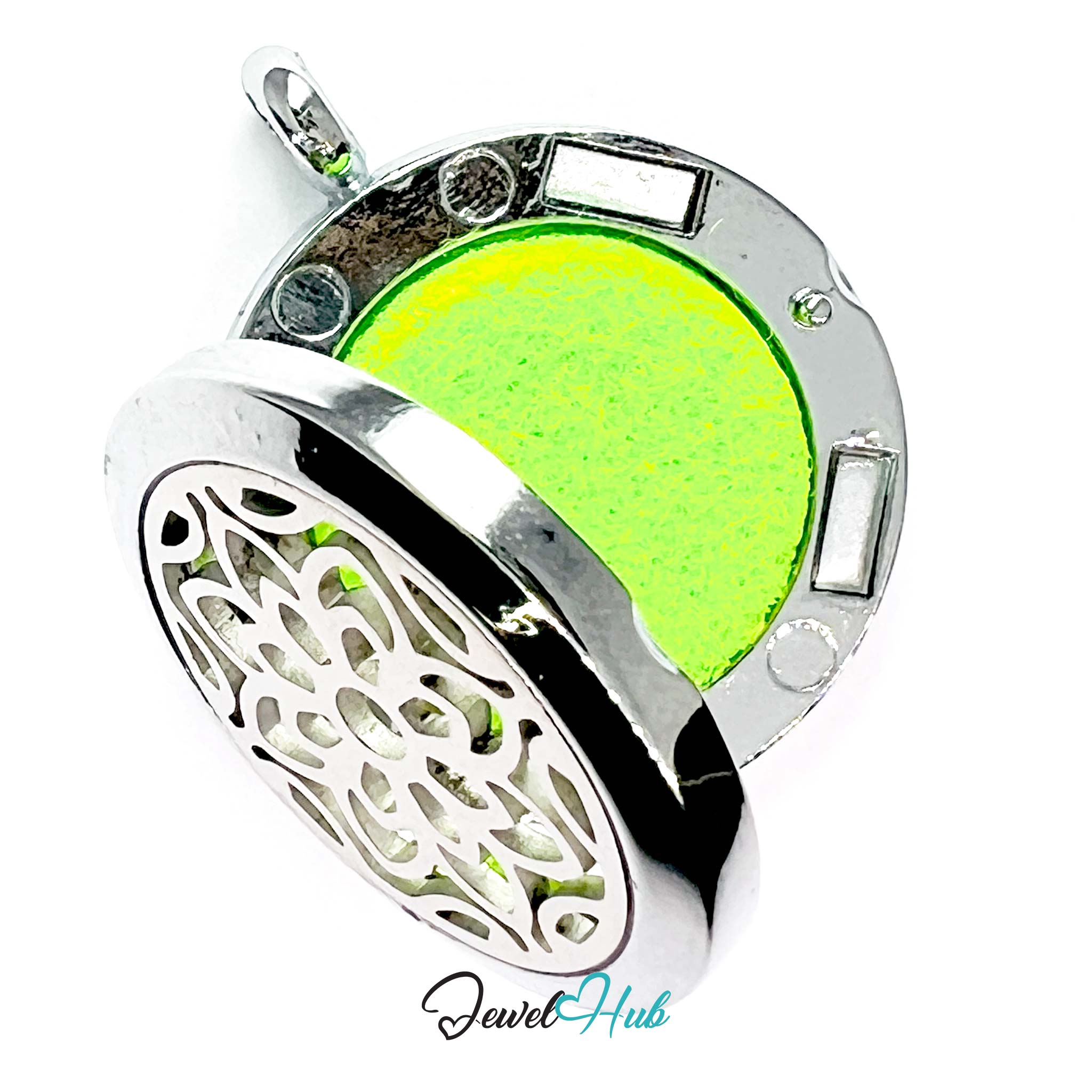 Silver pendant with a green heart-shaped center on a white background