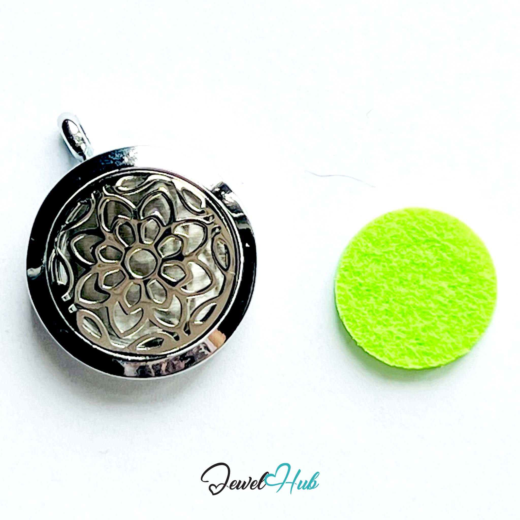 Silver floral pendant and green felt pad on a white background with 'Jewel Hub' branding.