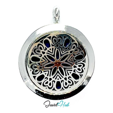 Silver pendant with intricate black design on a white background, branded 'Jewel Hub'.