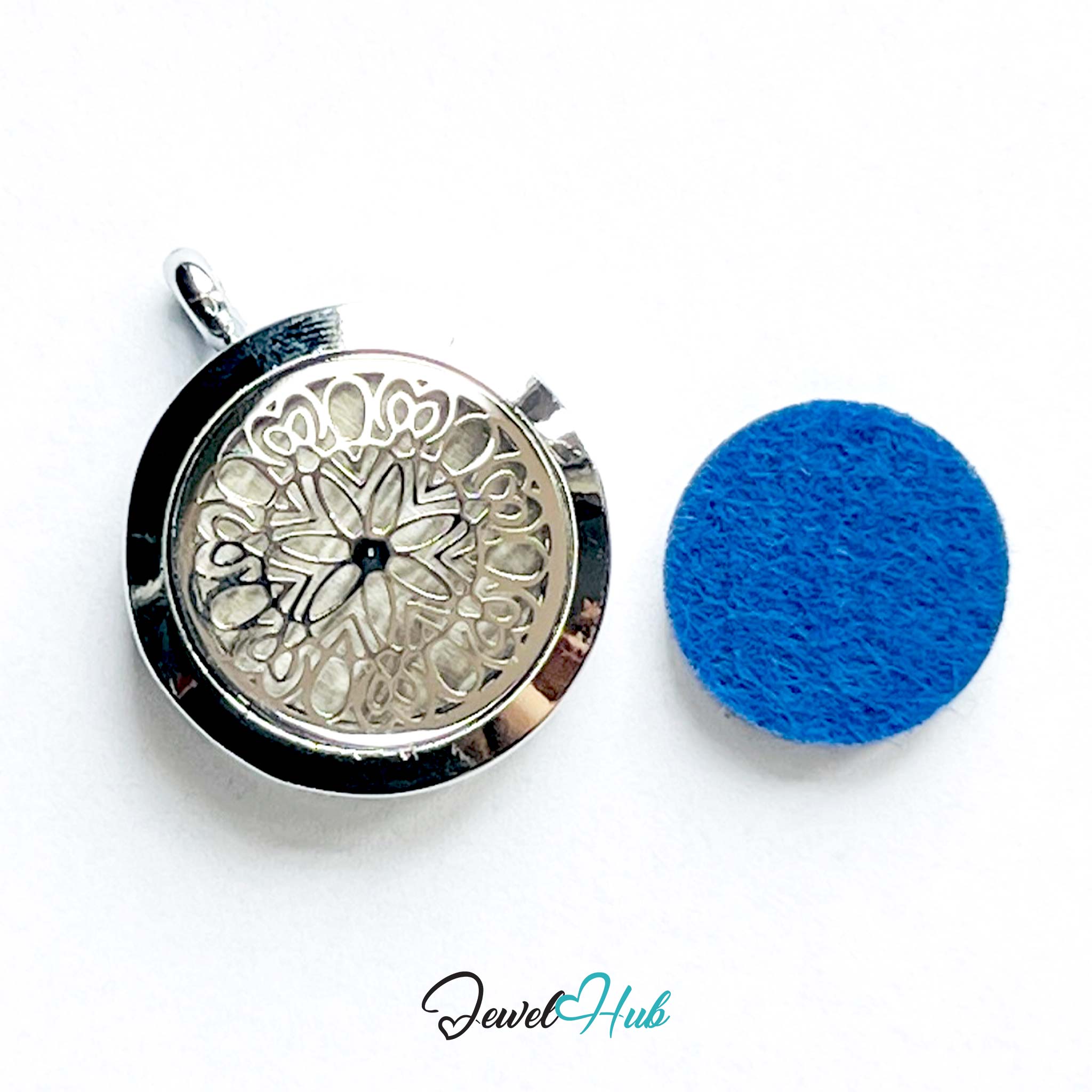 Decorative pendant with intricate design next to a blue felt patch on a white background, branded 'Jewel Hub'.