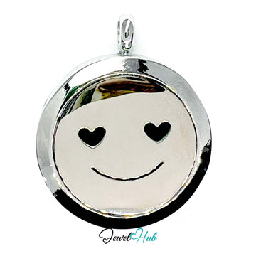 Silver pendant with smiley face design featuring heart eyes on a white background, brand 'Jewel Hub' visible.