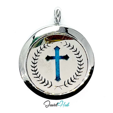 Silver pendant with blue cross design on a white background
