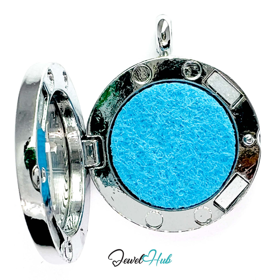 Silver pendant with blue cross design on a white background