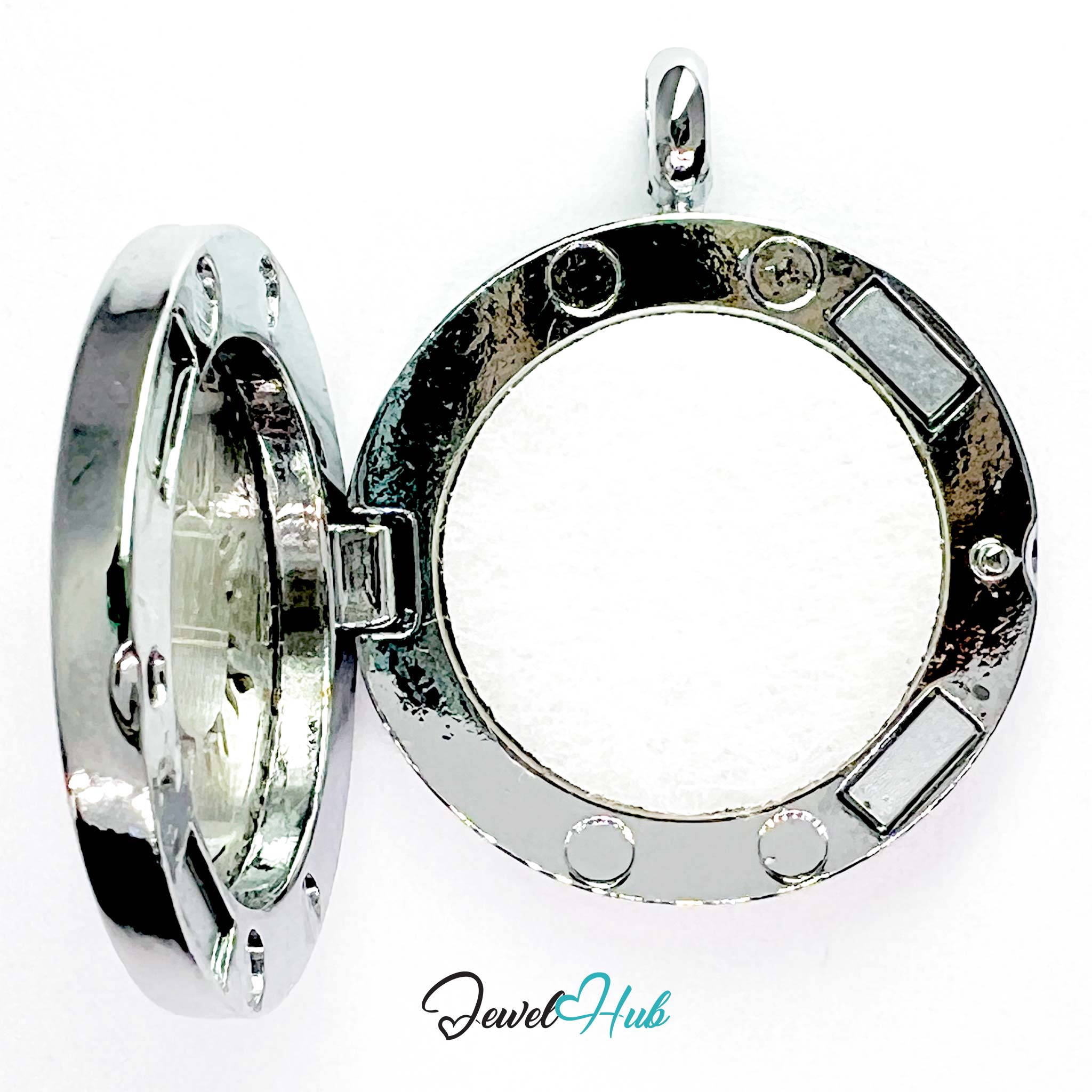 Silver locket with open design on a white background, branded 'Jewel Hub'.
