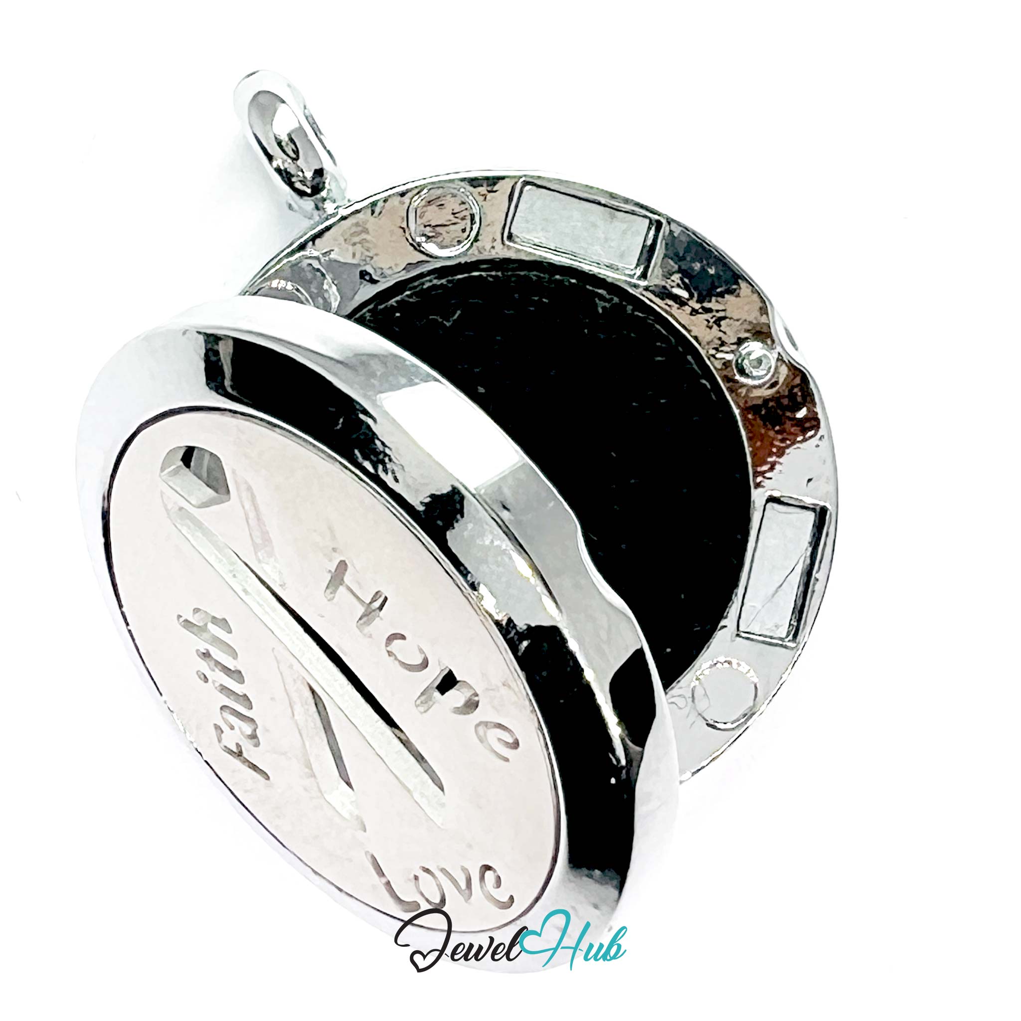 Silver pendant with engraved text on a white background