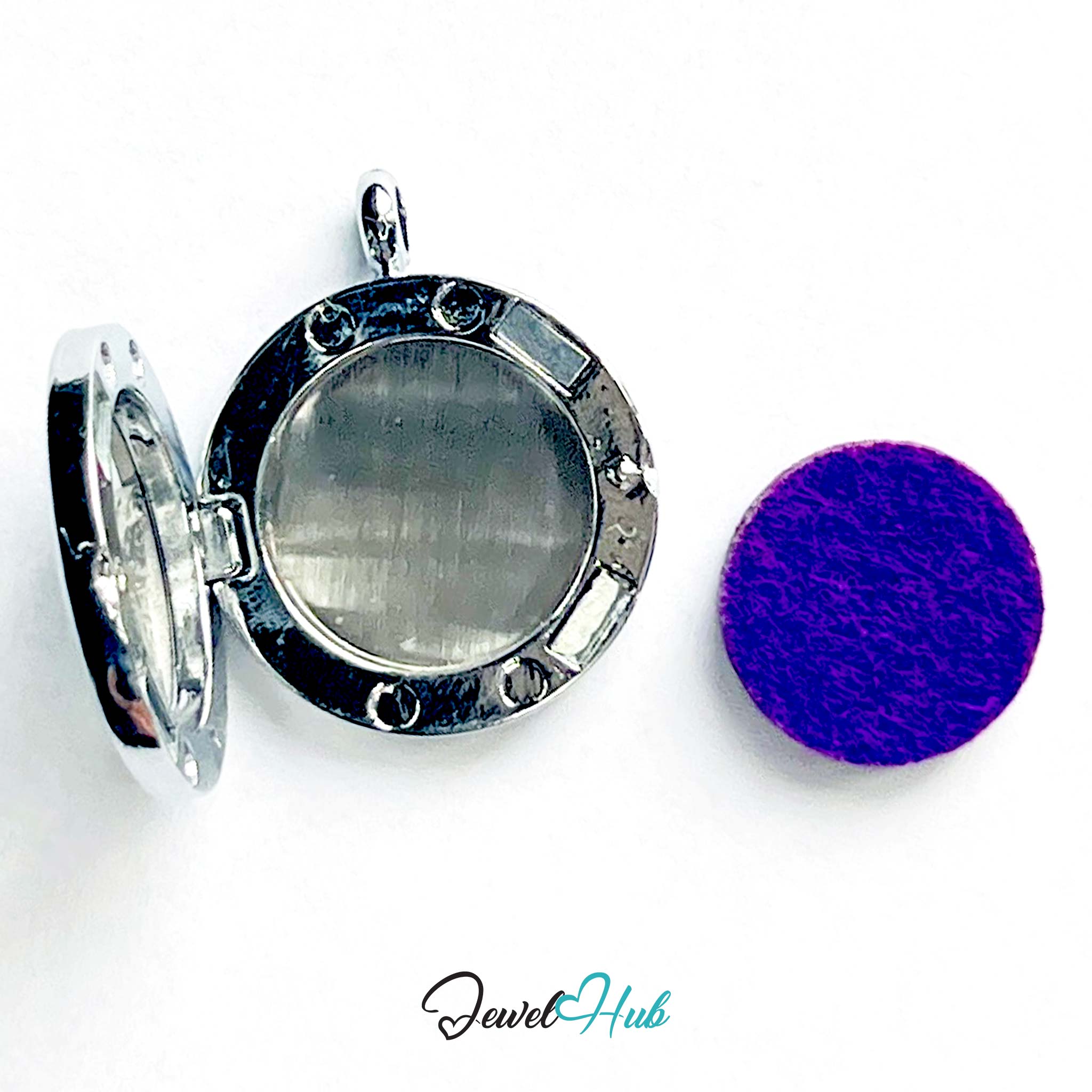 Silver locket with a purple round object on a white background, branded 'Jewel Hub'.