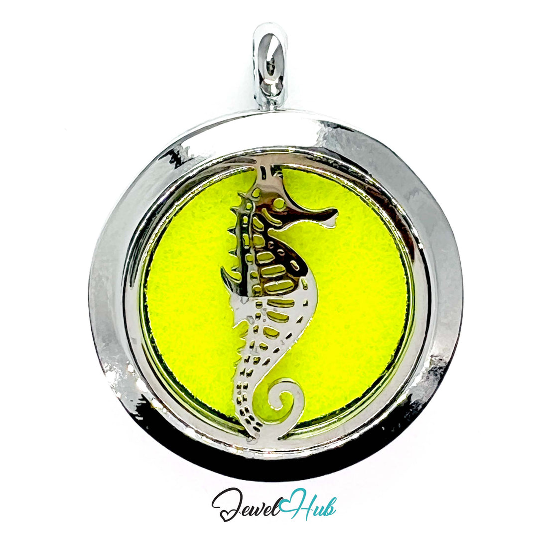 Round pendant with seahorse design on a yellow background, branded 'Jewel Hub'.