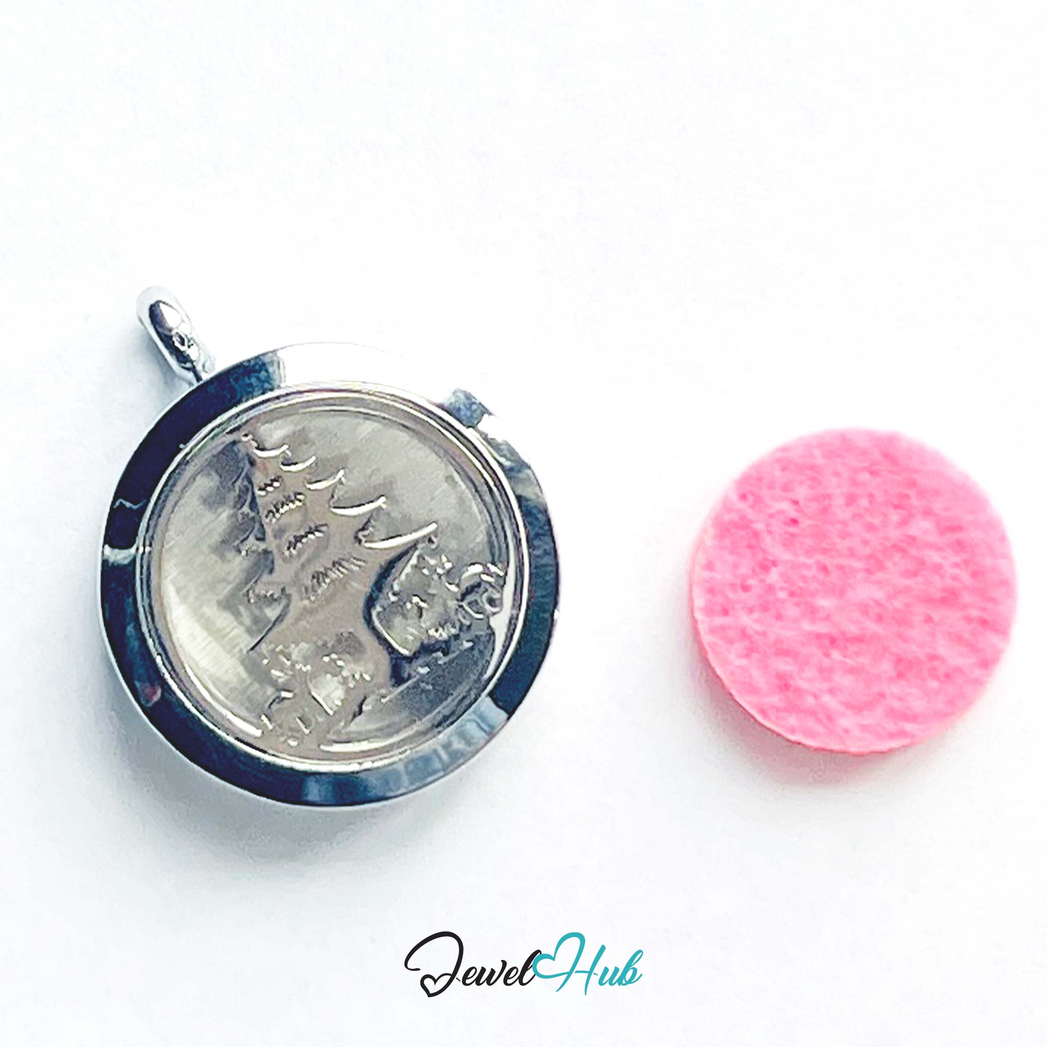 Silver pendant with ship design on a white background, next to a pink cleaning cloth, with 'Jewel Hub' branding.