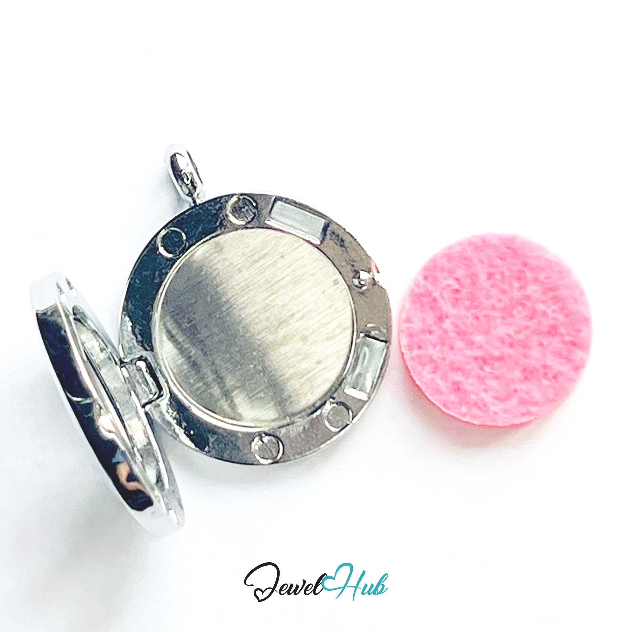 Silver round locket with a pink cleaning cloth on a white background, branded 'Jewel Hub'.