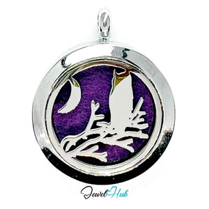 Silver pendant with a purple background and bird design, branded 'Jewel Hub'.