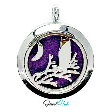 Silver pendant with a purple background and bird design, branded 'Jewel Hub'.