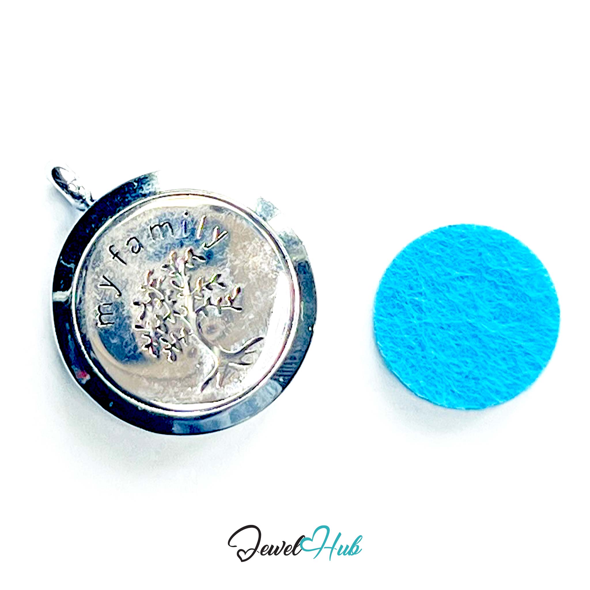 Silver pendant with 'family' and tree design next to a blue circular object on a white background, with 'Jewel Hub' branding.