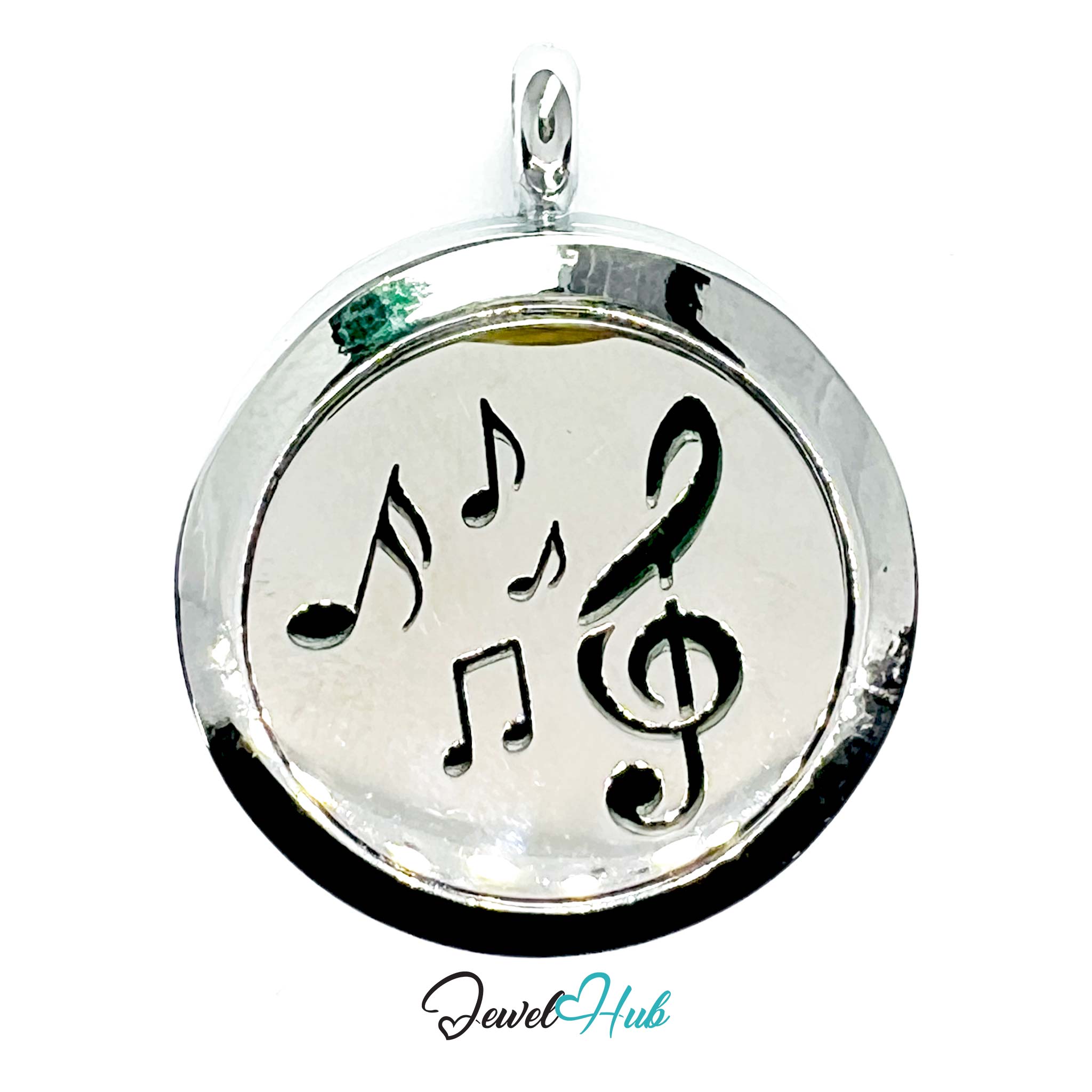 Silver pendant with musical notes on a white background