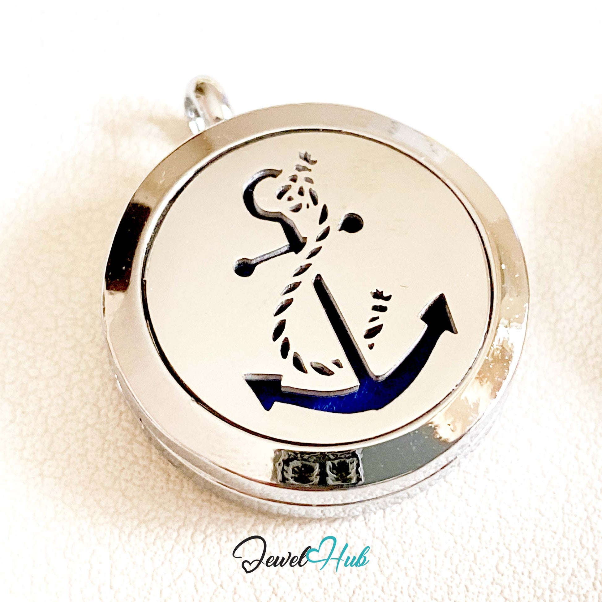 Circular pendant with anchor design on a white background, branded 'Jewel Hub'.