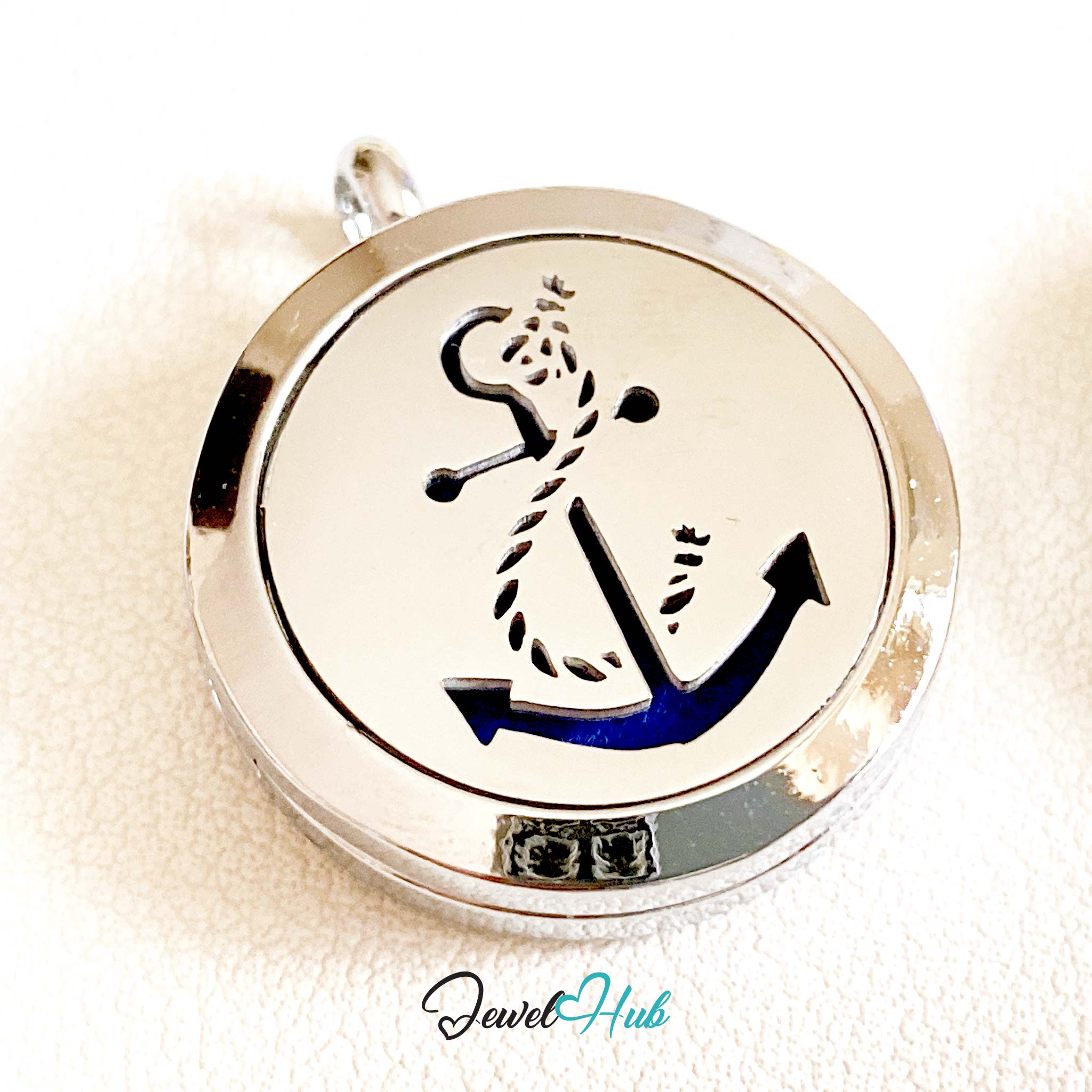 Circular pendant with anchor design on a white background, branded 'Jewel Hub'.