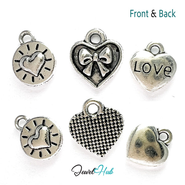 Collection of silver heart-shaped charms with various designs on a white background, labeled 'Jewel Hub'.