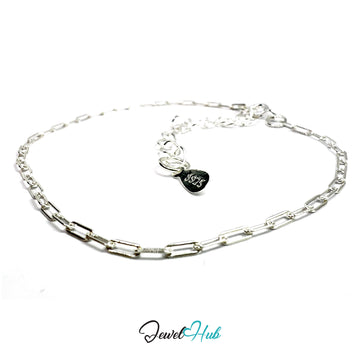 Silver chain bracelet with a heart-shaped tag on a white background, branded 'Jewel Hub'.