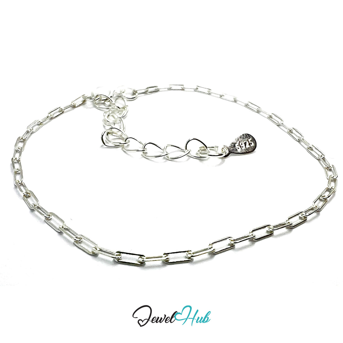 Silver chain bracelet with a heart-shaped tag on a white background, branded 'Jewel Hub'.