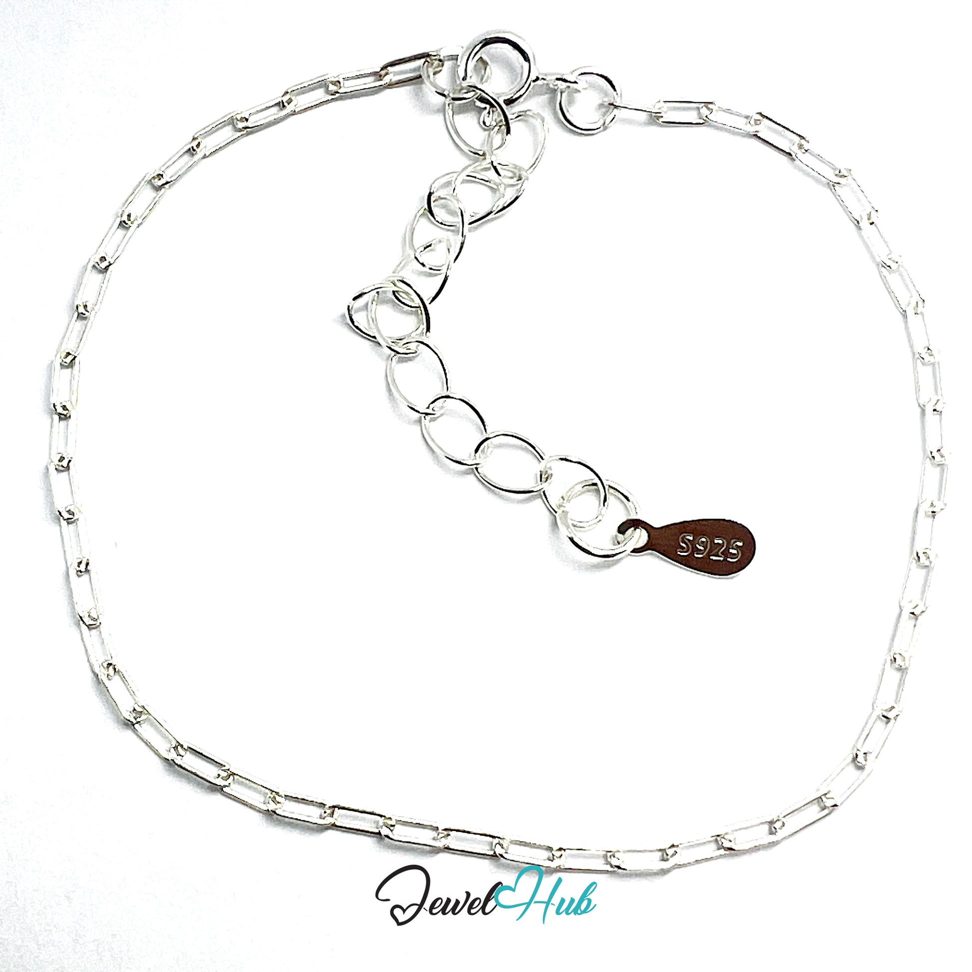 Silver chain bracelet with a brown leather tag on a white background, branded 'Jewel Hub'.