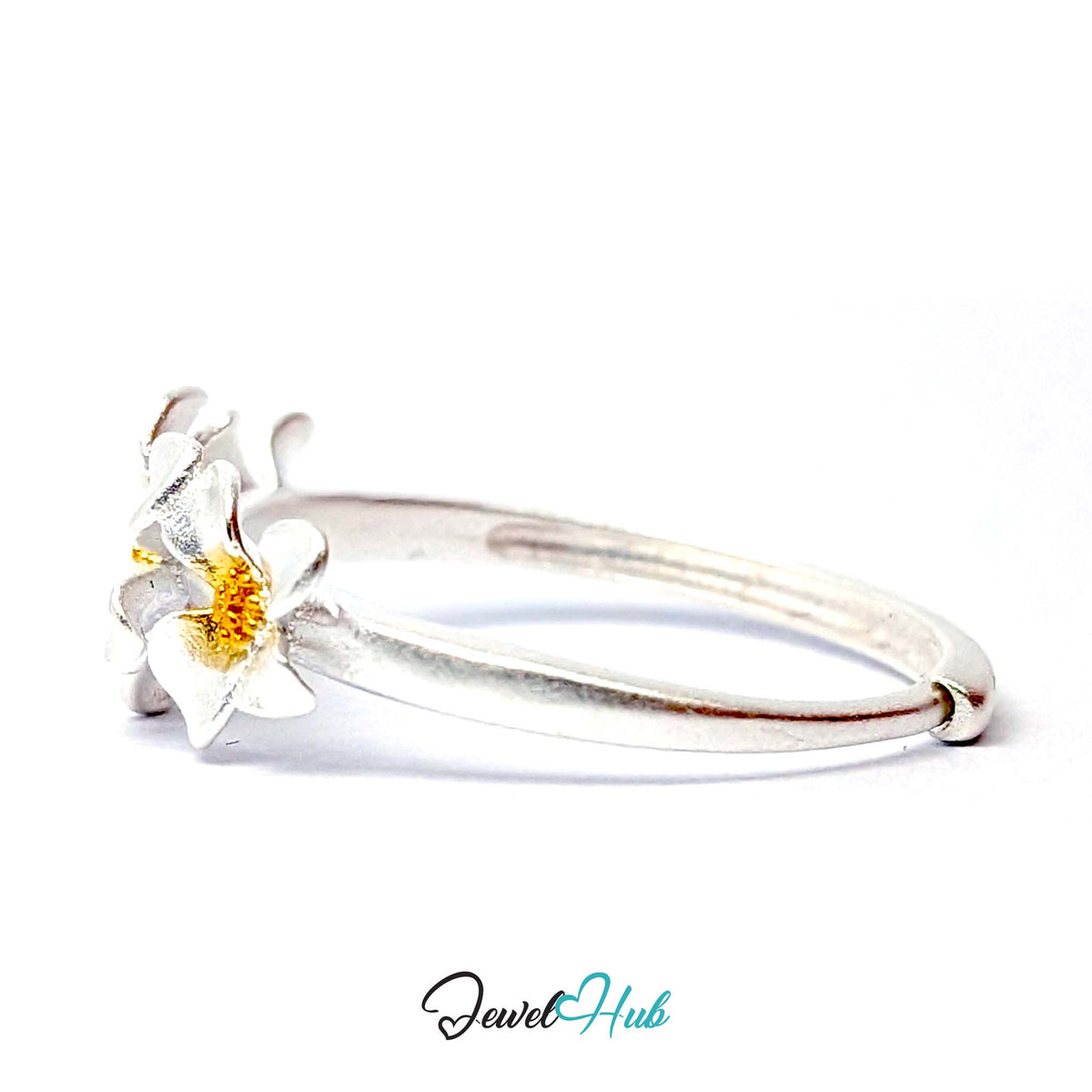 Side profile of the Three Flower Ring, showing the slim round band and raised flower panel