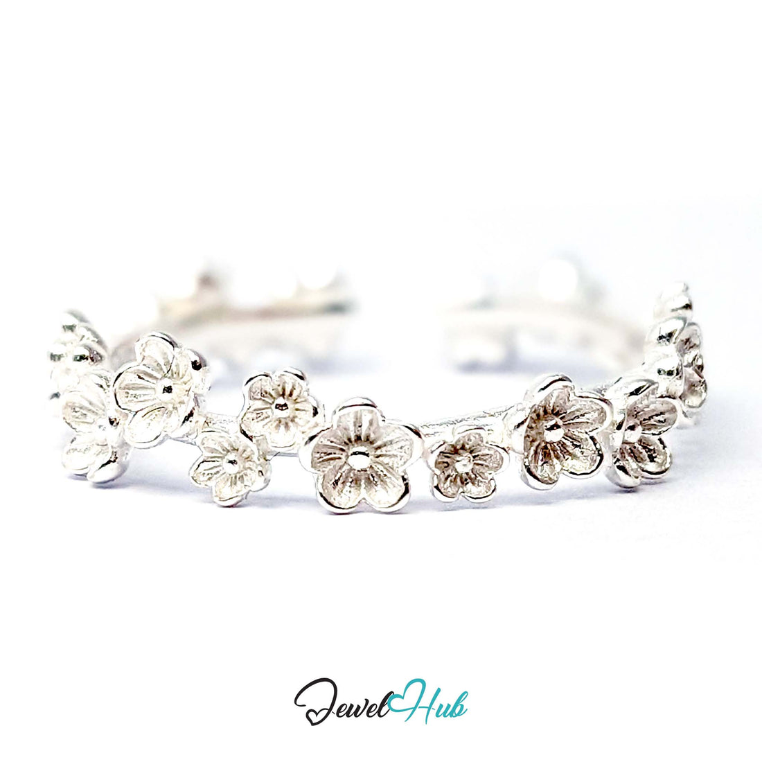Blossom Band Ring in 999 fine silver, a 4.6mm band of small five-petal flowers, front view