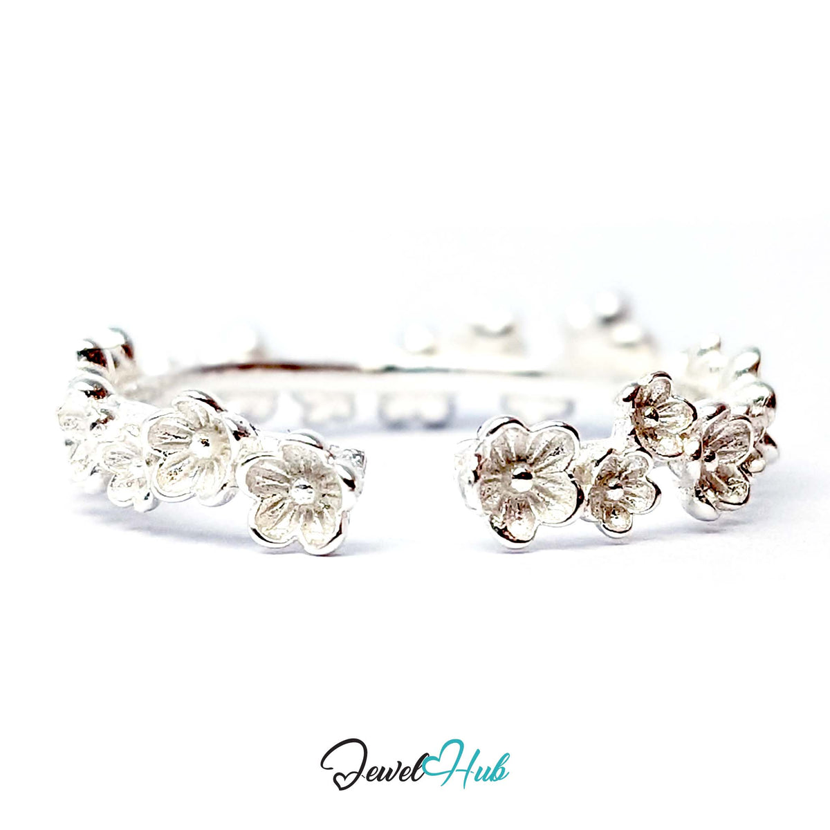 Blossom Band Ring showing the open back of the band and the row of matt silver flowers