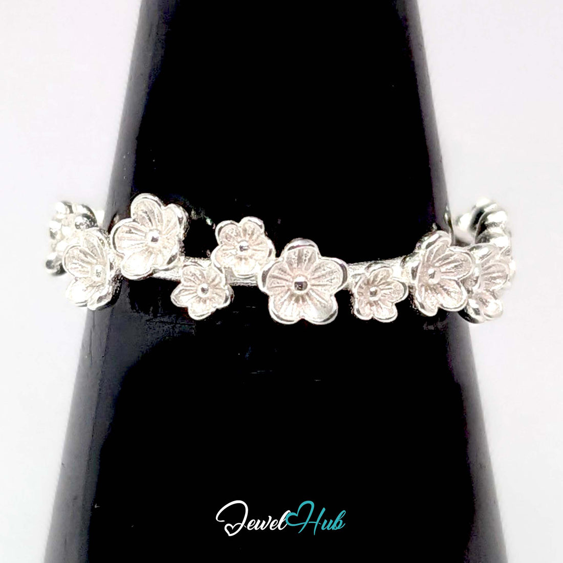 Blossom Band Ring in 999 fine silver, a 4.6mm band of small five-petal flowers, front view
