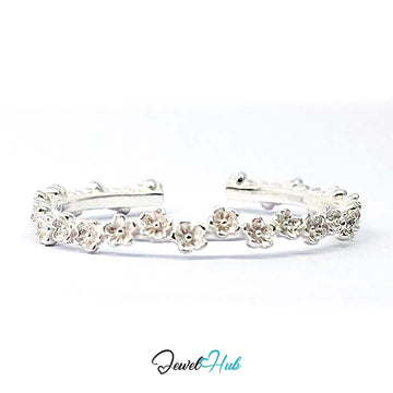 Mini Blossom Band Ring in 999 fine silver, a 2.5mm band of tiny five-petal flowers, front view