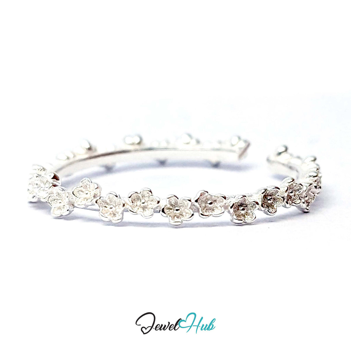 Mini Blossom Band Ring at an angle, showing the fine row of miniature blossoms