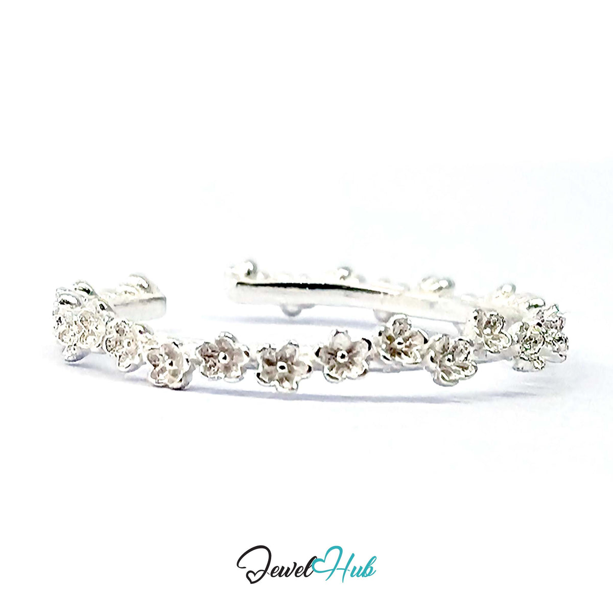Mini Blossom Band Ring angled to show the adjustable opening