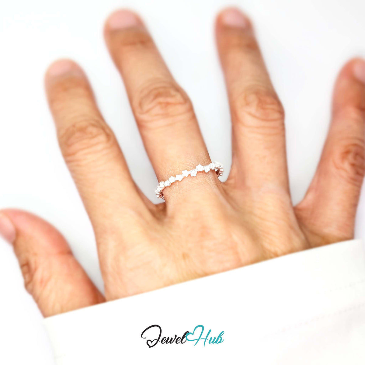 Mini Blossom Band Ring worn on a hand, showing the fit of the adjustable M-O band