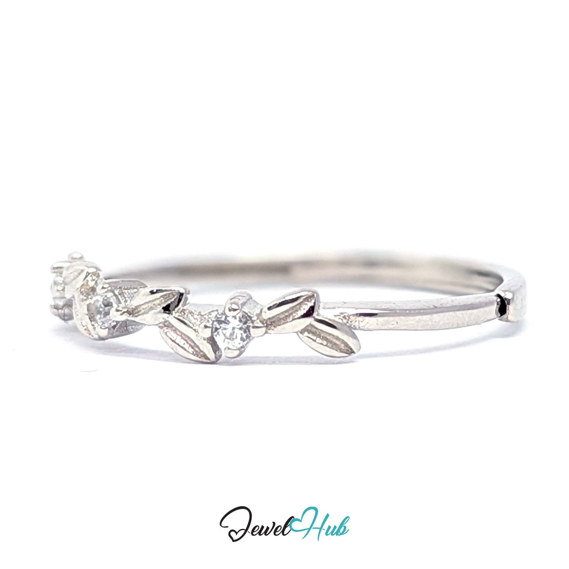 Leaf Vine Ring at an angle, showing the polished 3mm band and the set stones