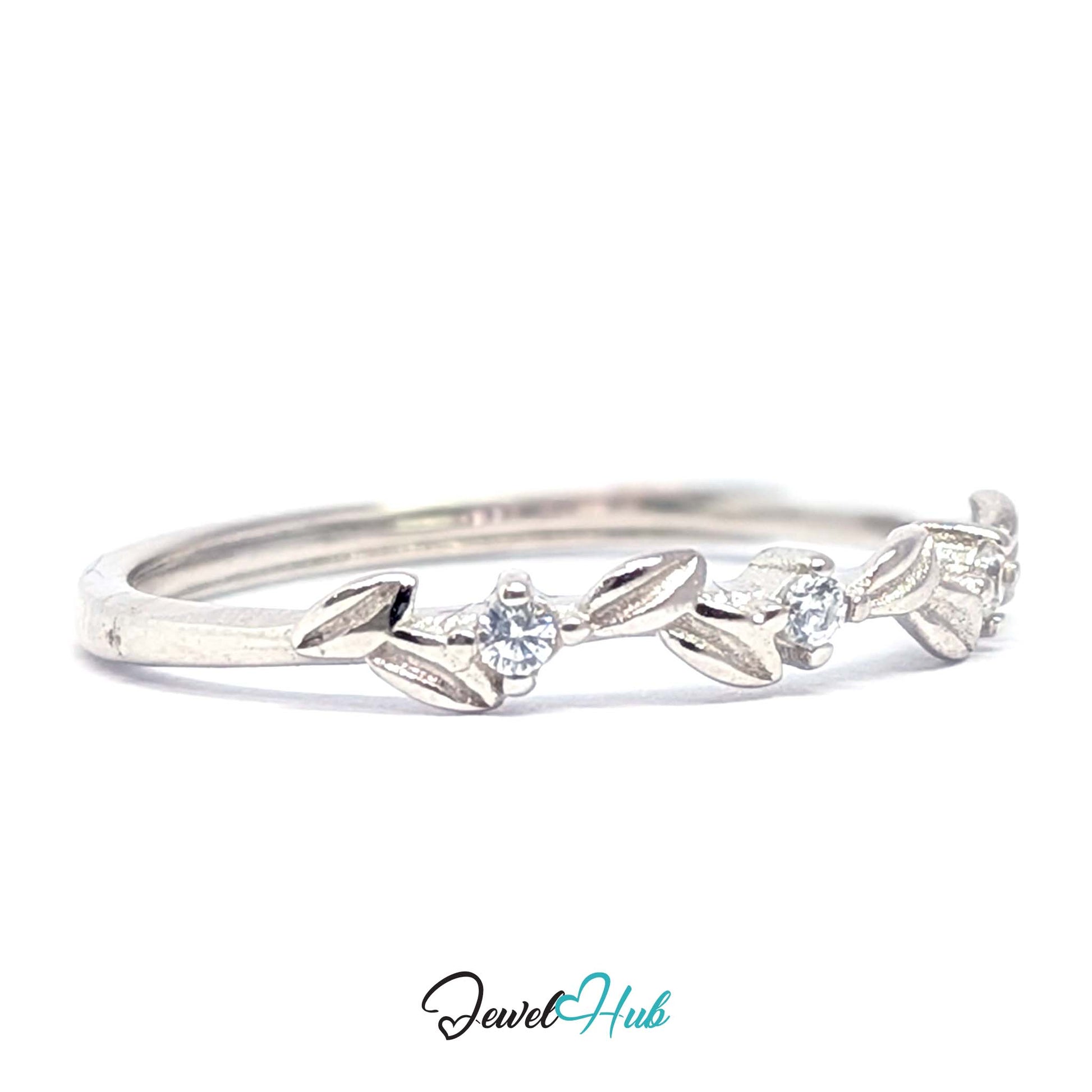 Close view of the leaf motif and three clear zirconia on the Leaf Vine Ring