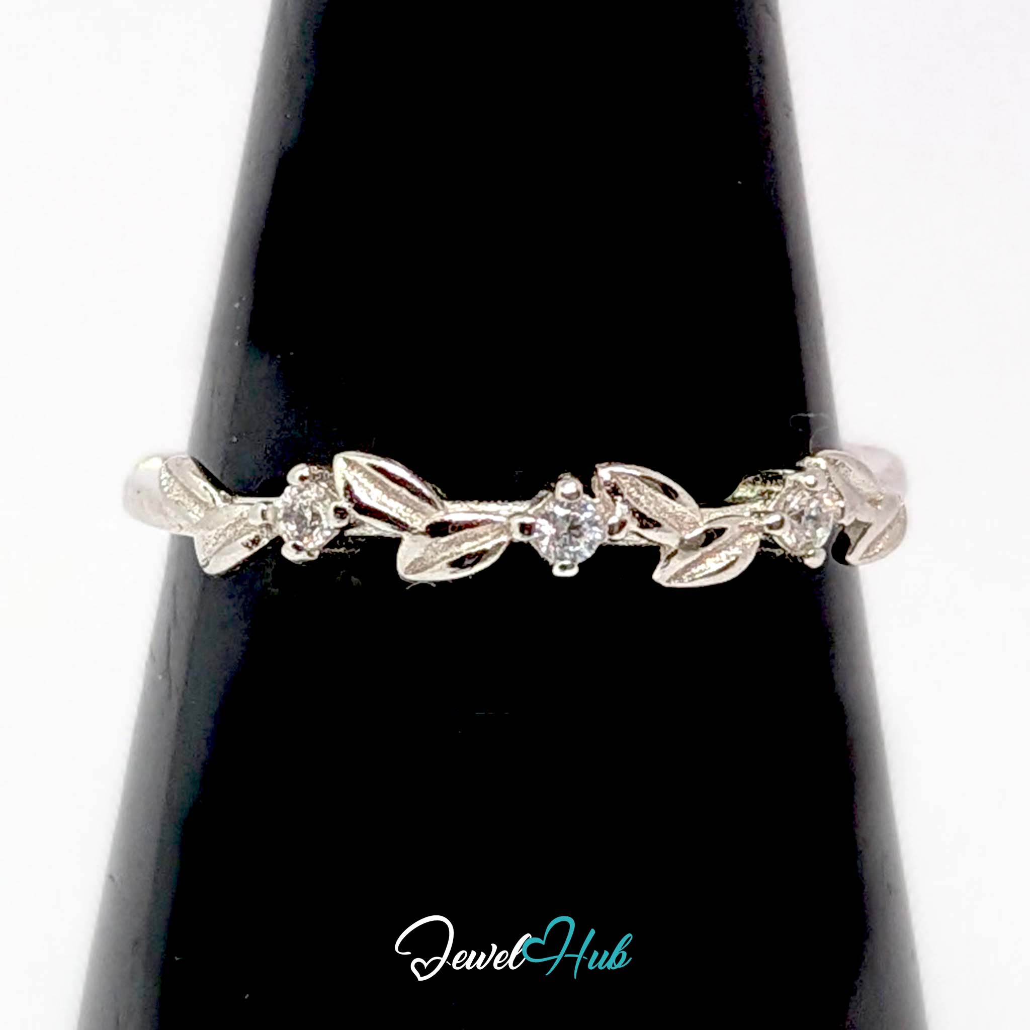 Leaf Vine Ring against a black cone, showing the spaced zirconia sparkle