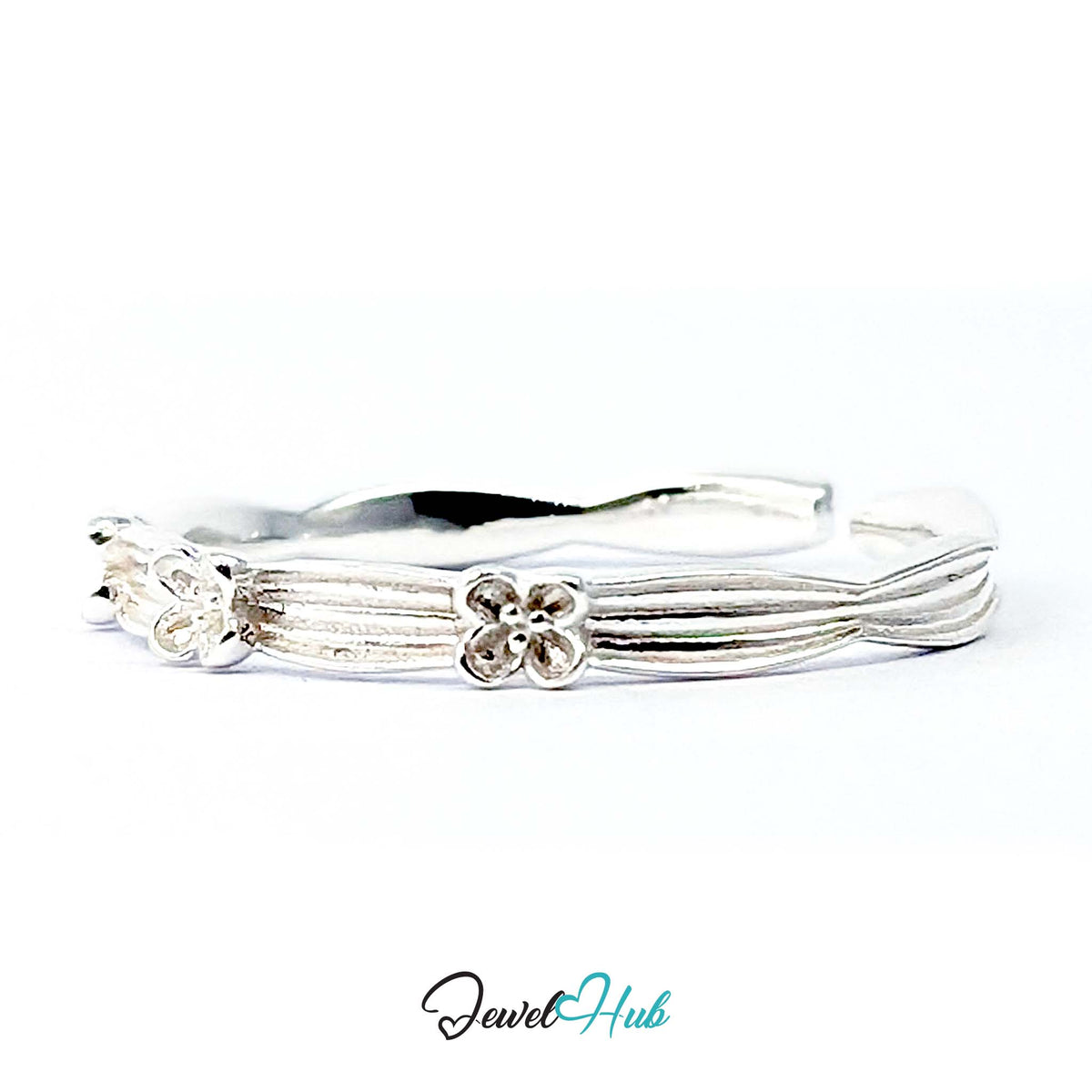 Flower Band Ring at an angle, showing the ribbed band and the open adjustable gap