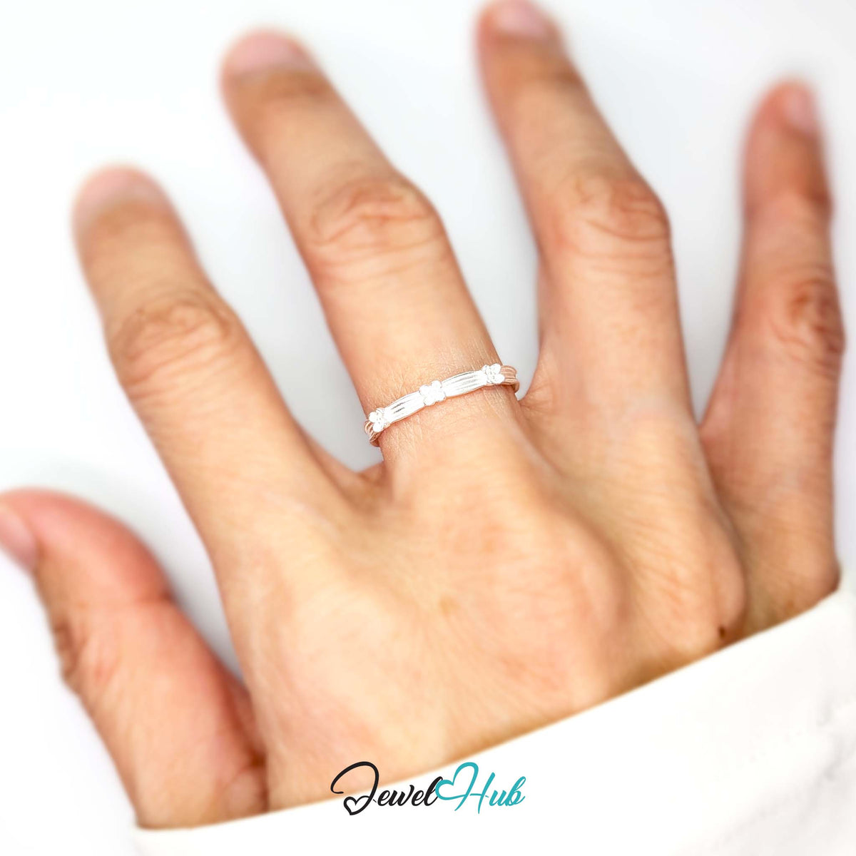 Flower Band Ring worn on a hand, showing the fit of the adjustable M-O band