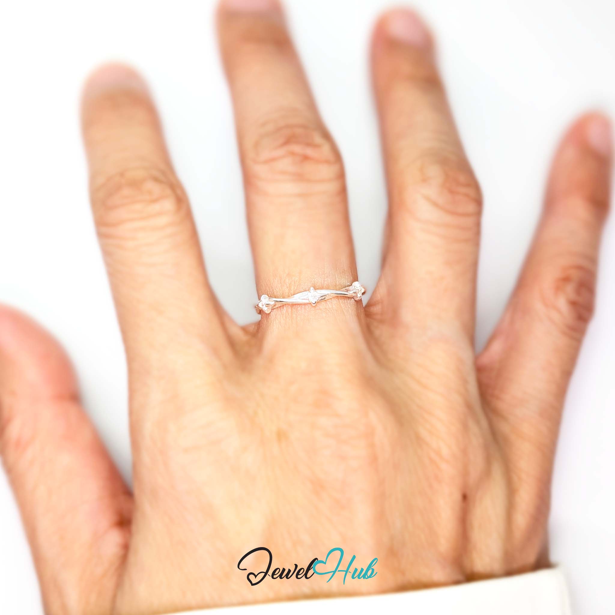 Three Spark Ring worn on a hand, showing the fit of the adjustable M-O band