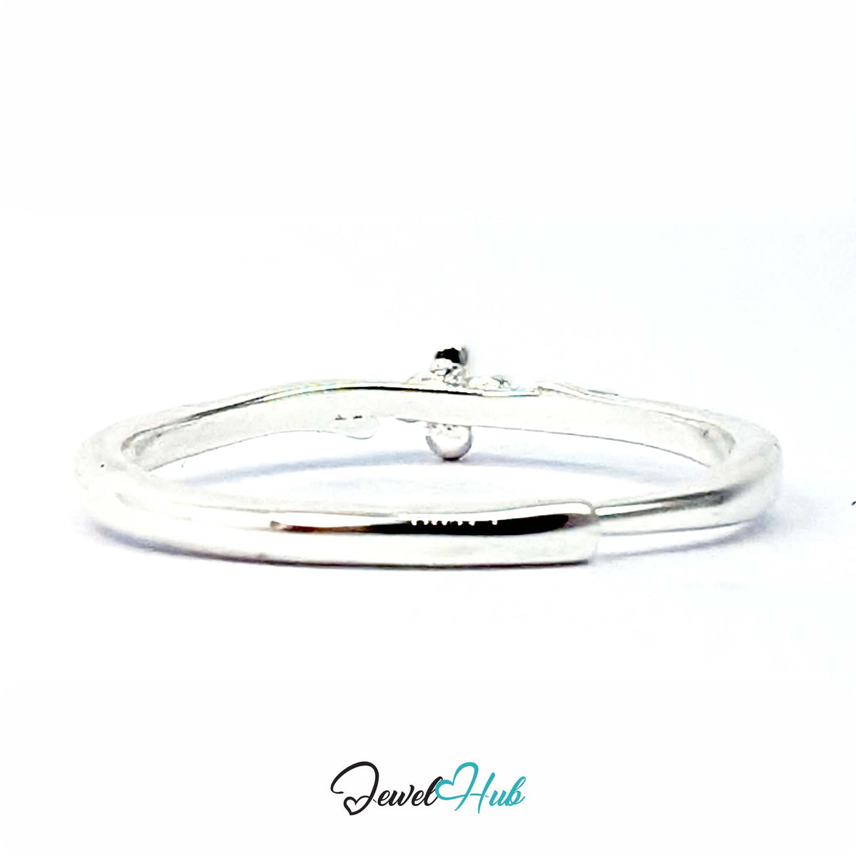 Side view of the Single Flower Ring, showing how slim the band sits