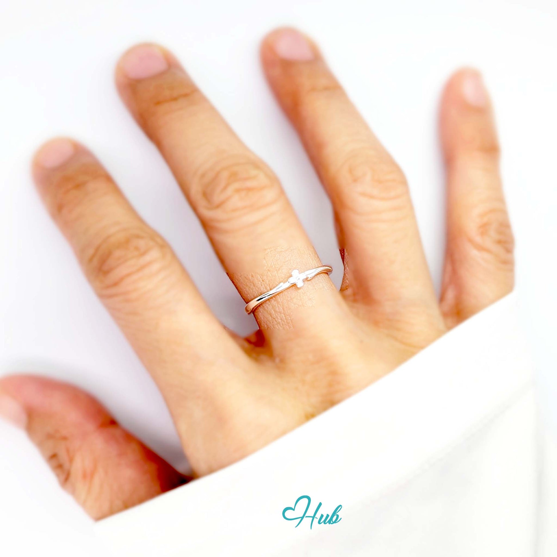 Single Flower Ring worn on a hand, showing the fit of the adjustable M-O band