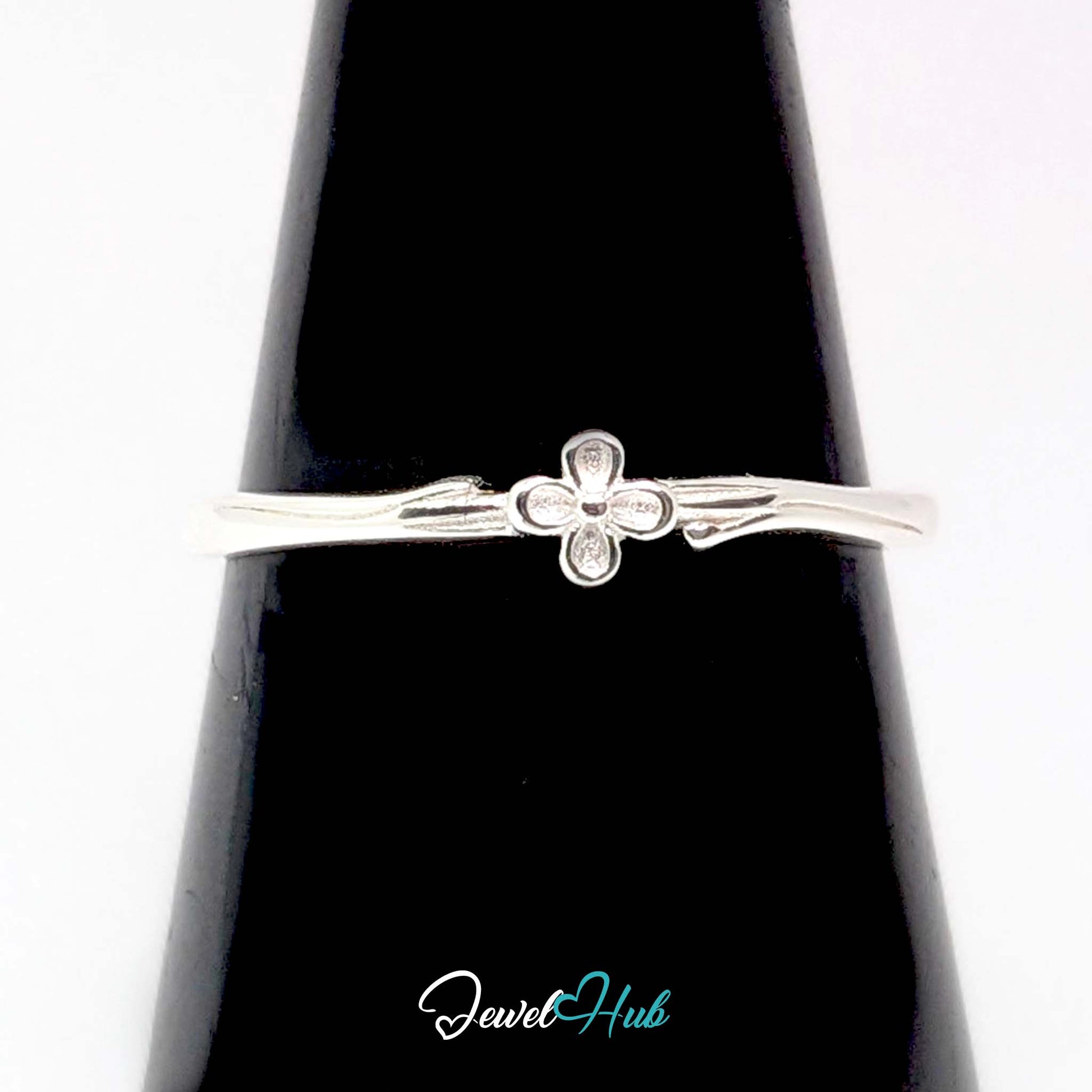 Single Flower Ring against a black cone, showing the bloom and leaf detail