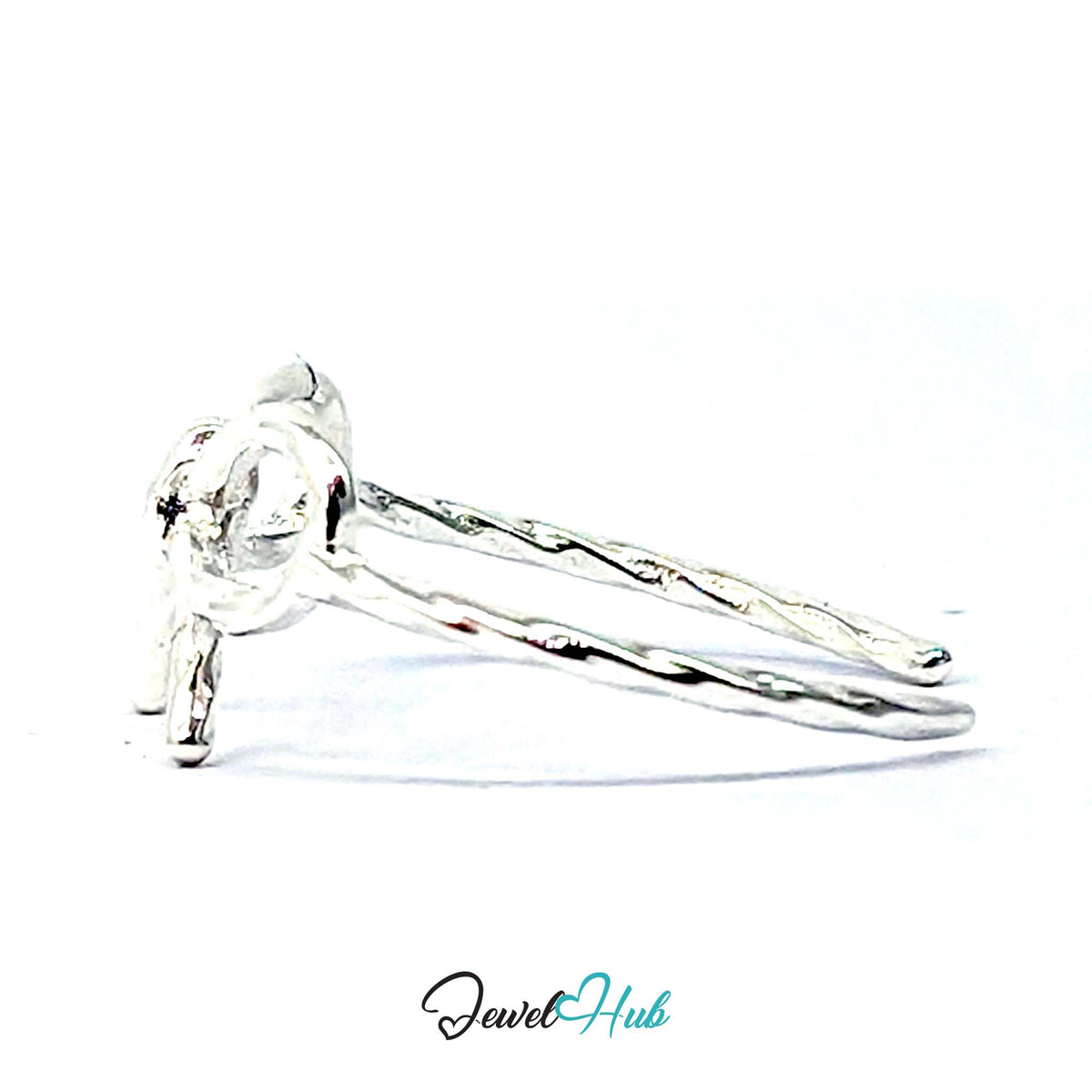 Bow Ring from the side, showing the tails running back into the band