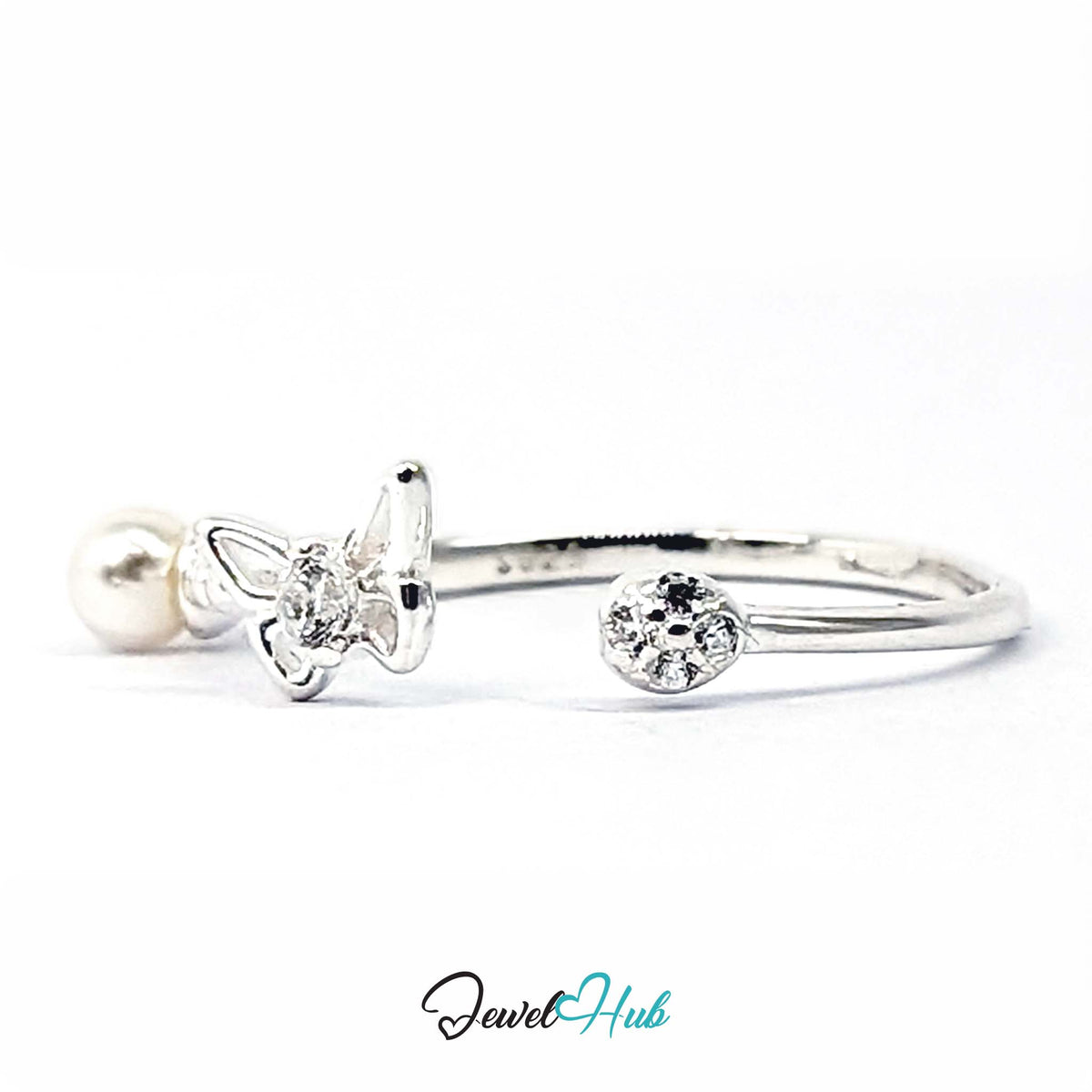 Faux pearl, crystal-set butterfly and single crystal spaced along an open 925 sterling silver band - JewelHub
