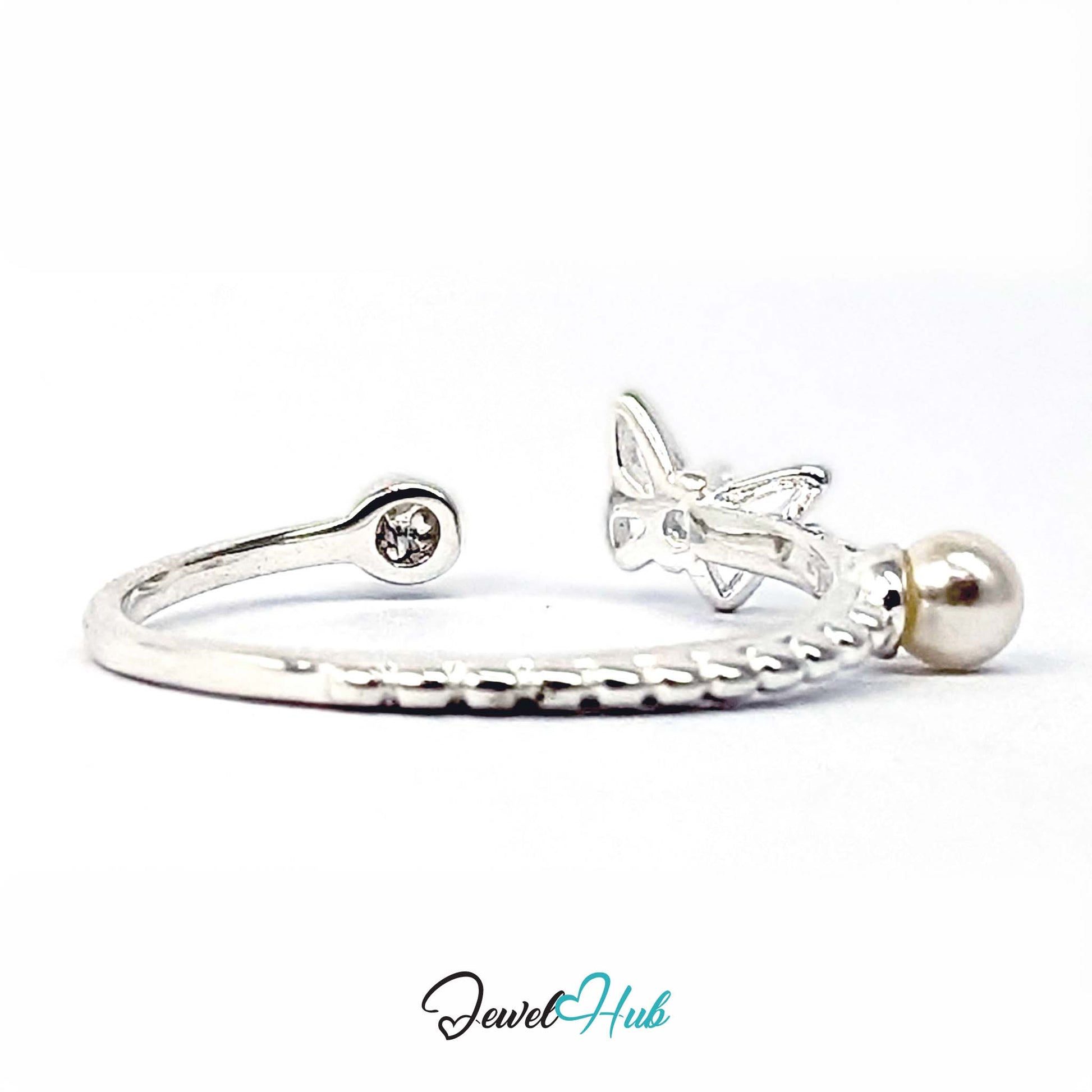 Side view of the butterfly ring, showing the raised butterfly and prong-set crystal - JewelHub