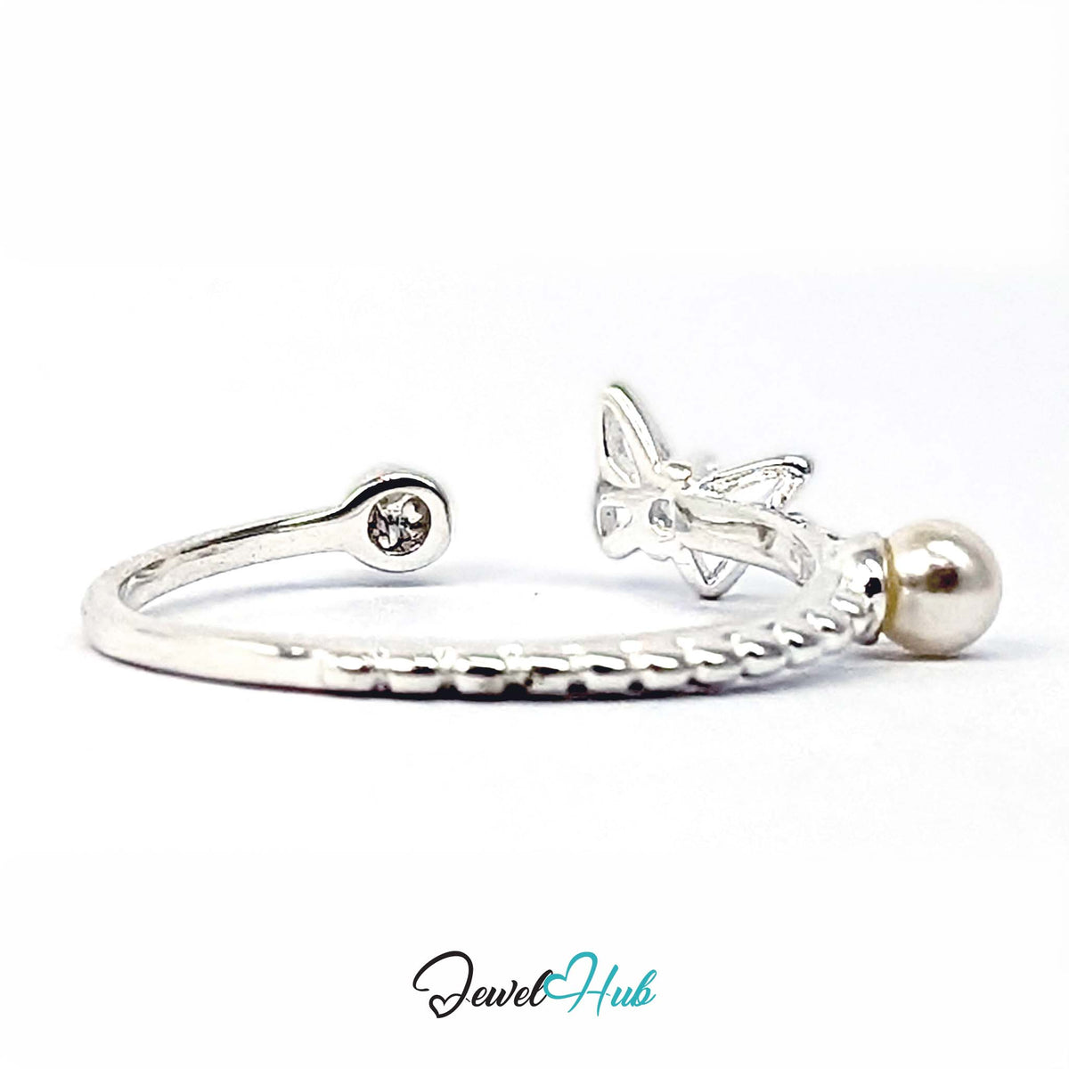 Side view of the butterfly ring, showing the raised butterfly and prong-set crystal - JewelHub