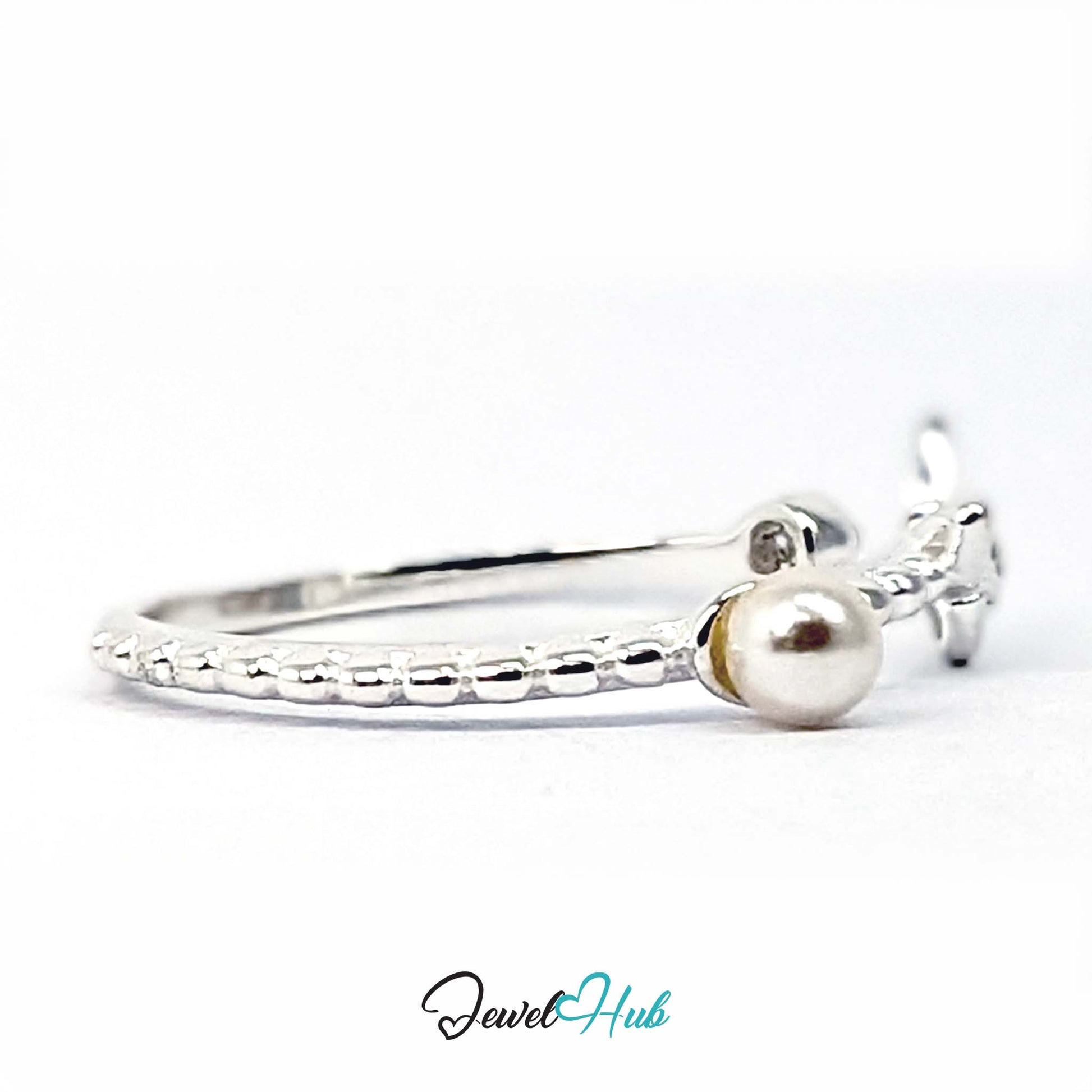 Butterfly ring at an angle, with the 3mm faux pearl in the foreground - JewelHub