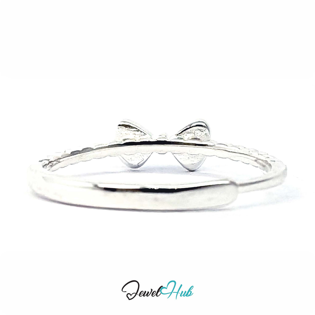 Bow ring from above, showing the rounded loops and the beaded shoulder - JewelHub