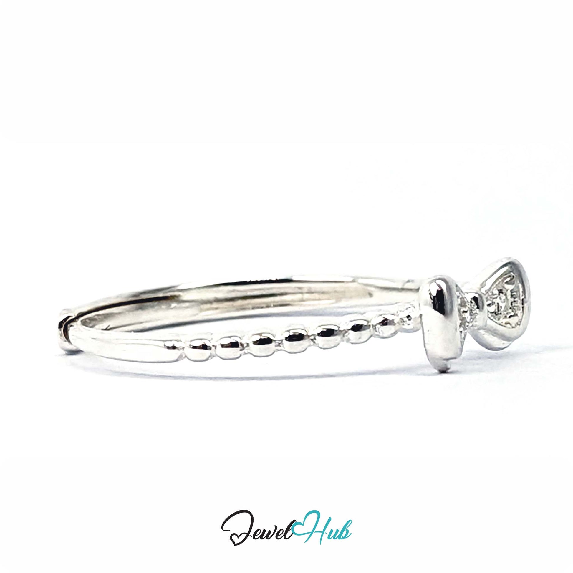 Bow ring at an angle, with the beaded band running away from the knot - JewelHub